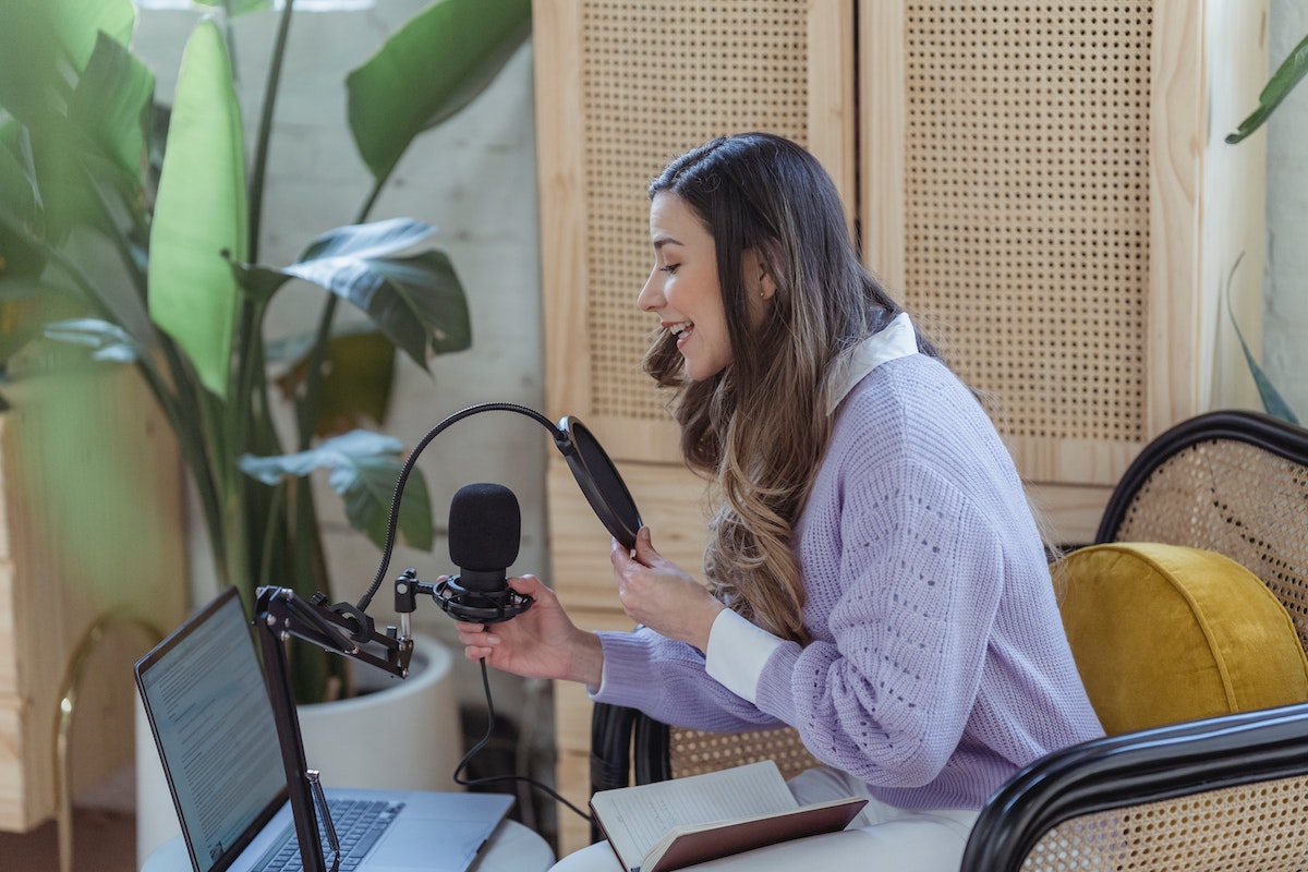 A podcast host setting up to film an episode