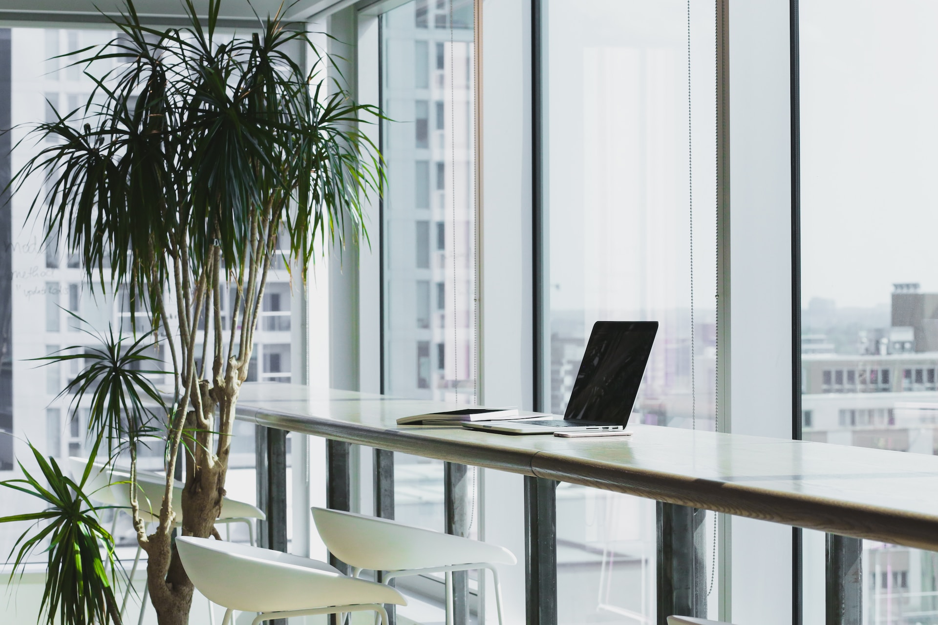 Laptop of independent real estate agent on table.