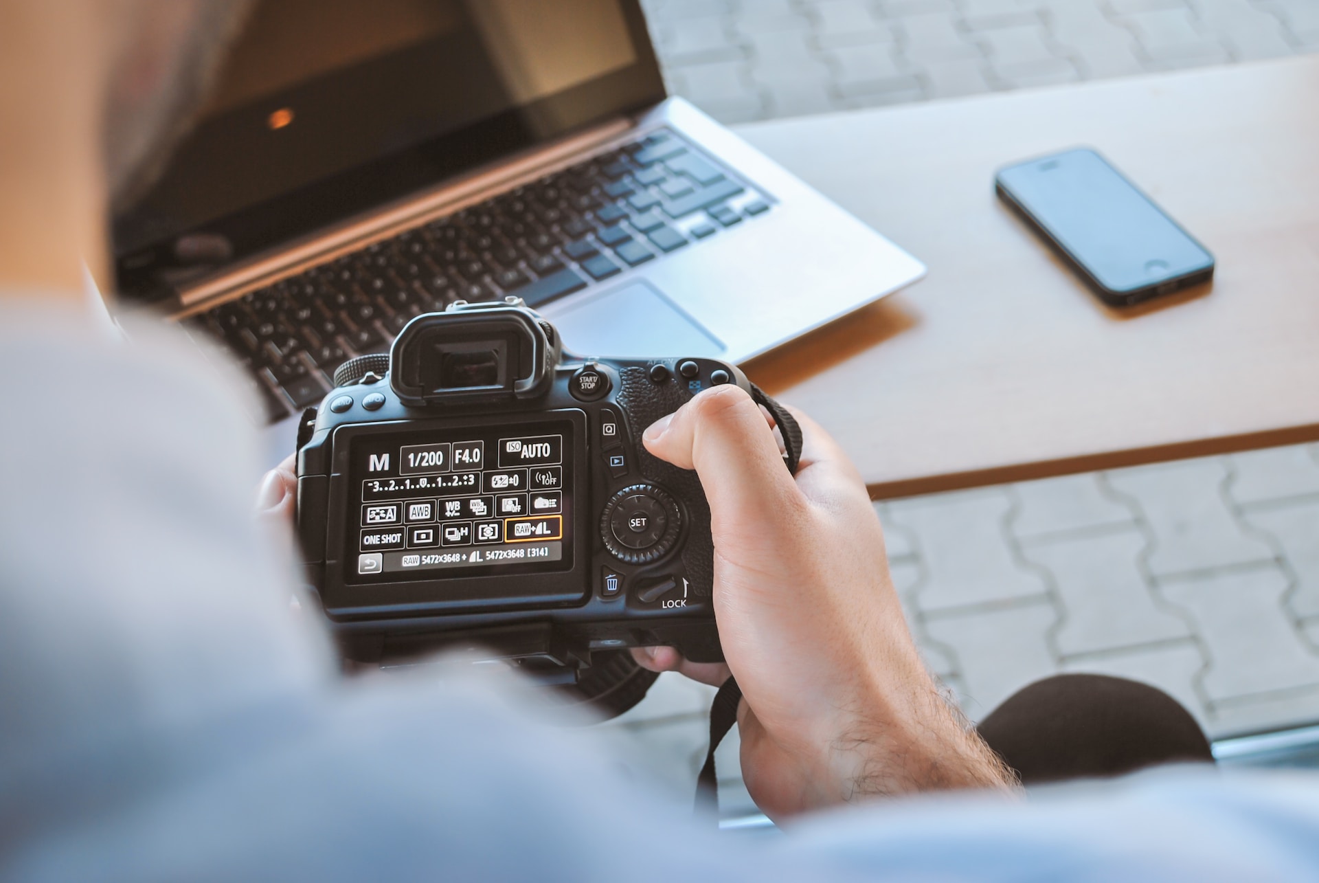 Man using a camera for his real estate photography business.