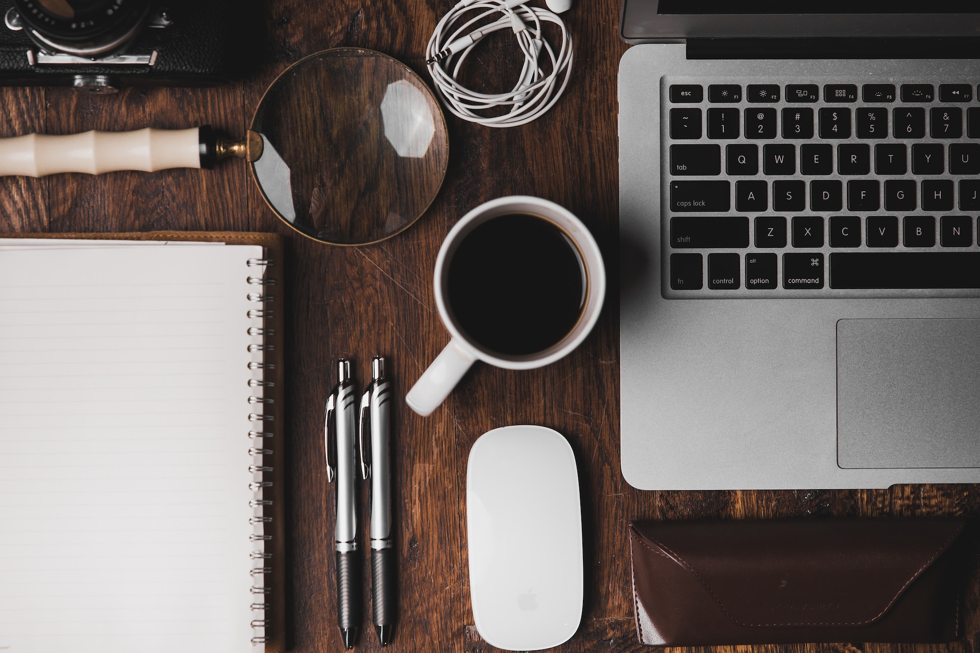 Office desk with coffee and other items of a real estate agent.