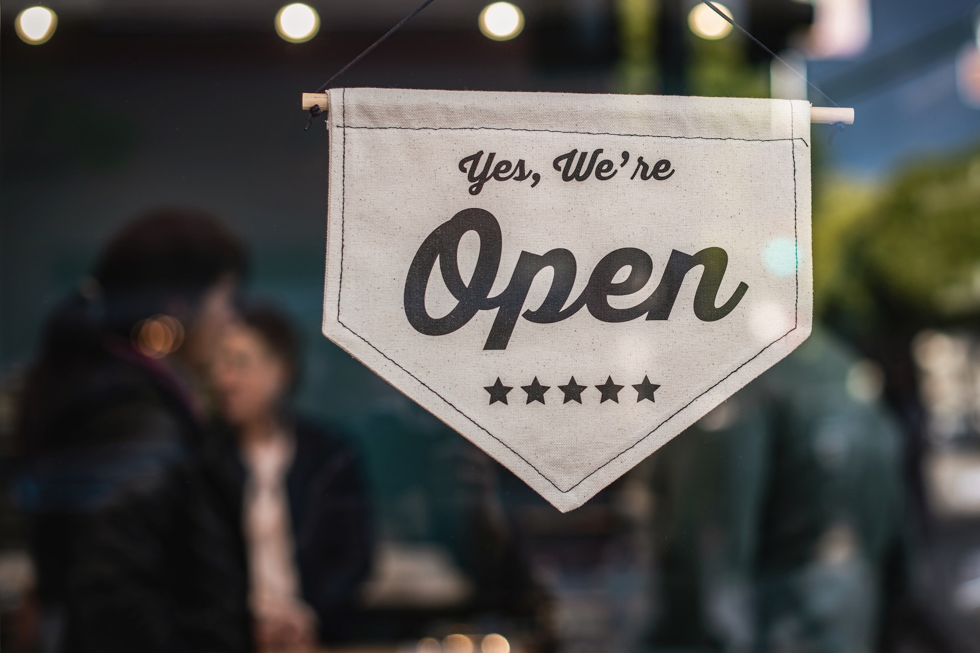 A commercial property showing a open for business sign.