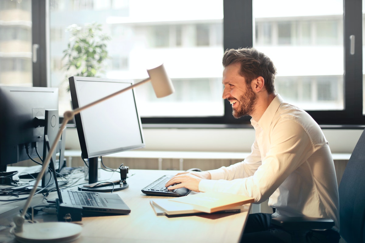 Man segmenting email lists on a computer