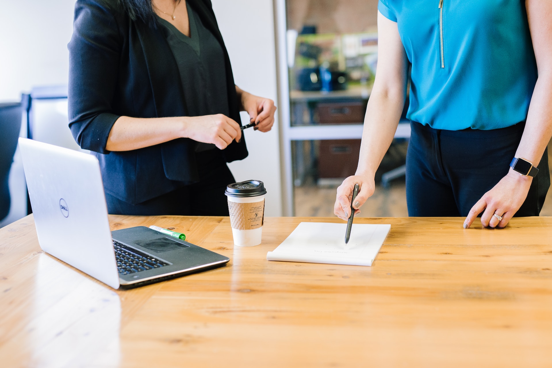 Real estate investment mentor explaining a strategy to a woman.