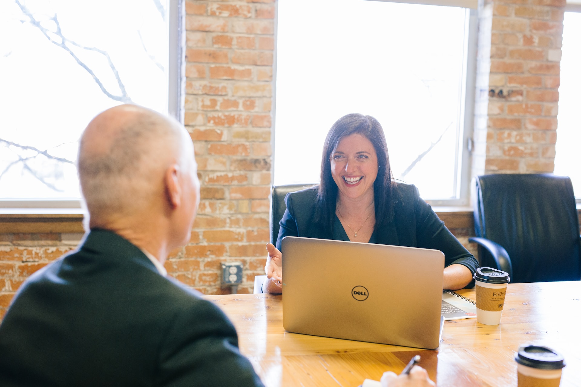 Real estate mentor laughing with her mentee.