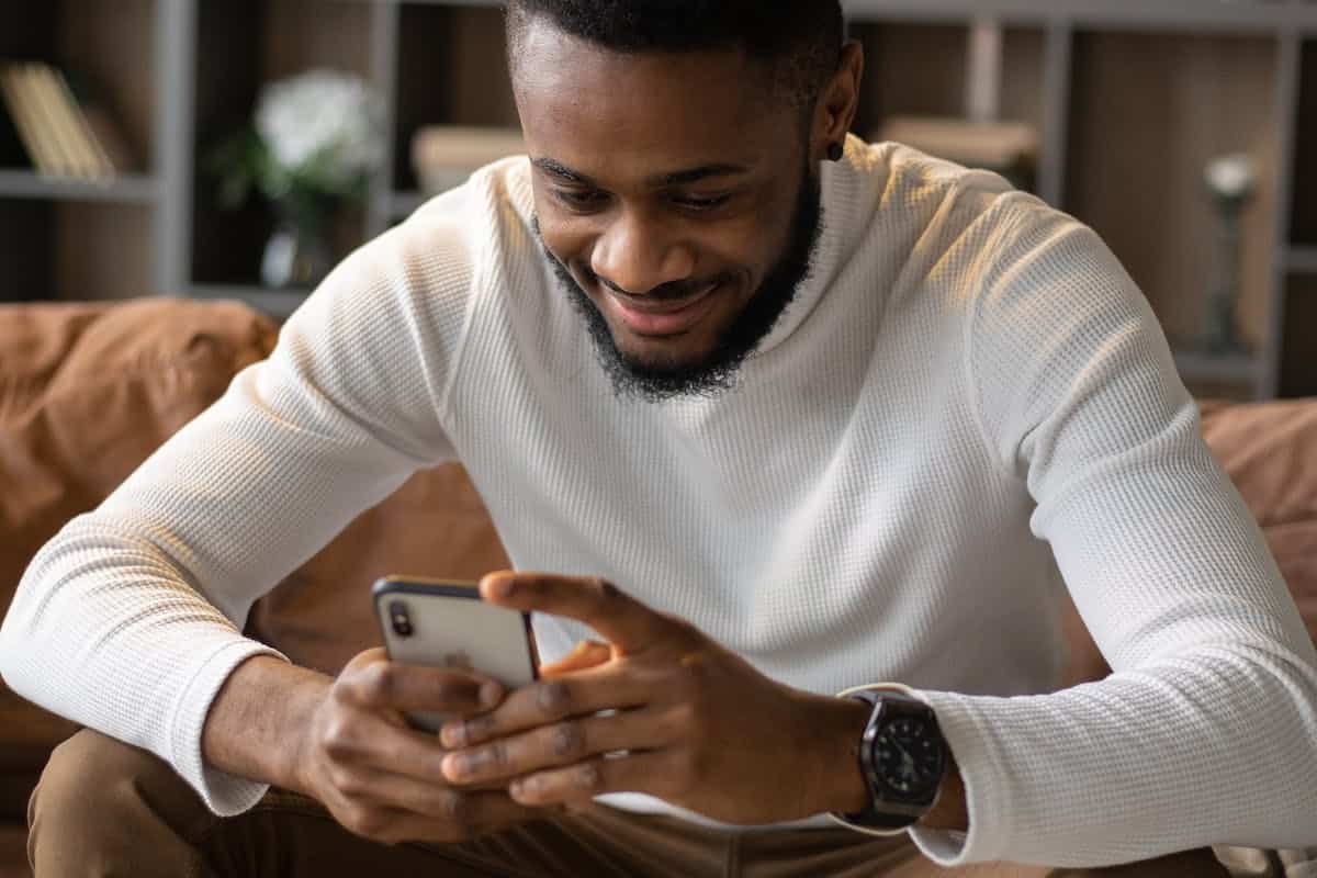 Man looking through social media posts.