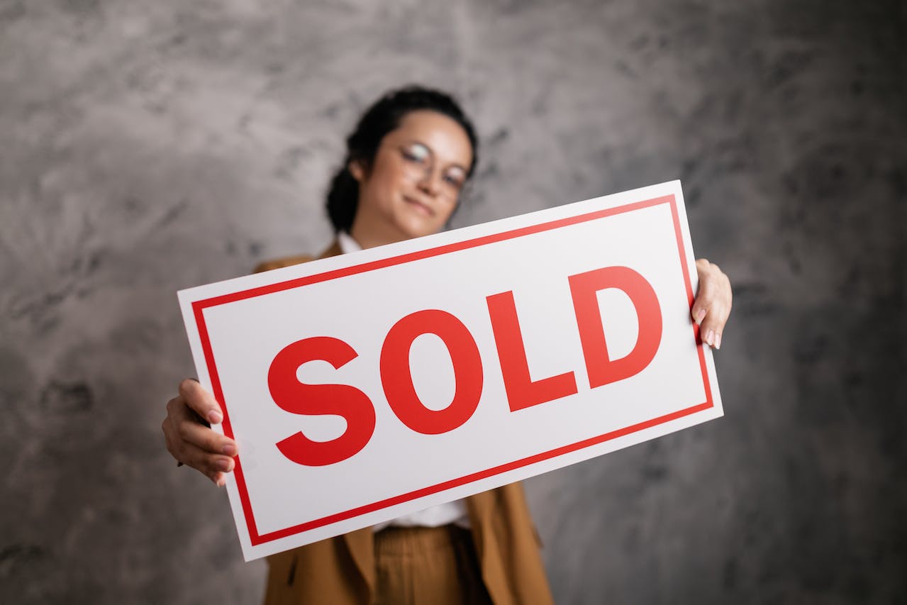 Woman Holding a Signboard