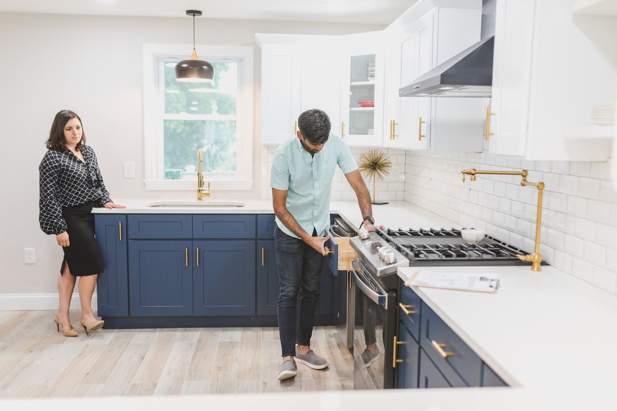 A Man Inspecting the Kitchen Drawer