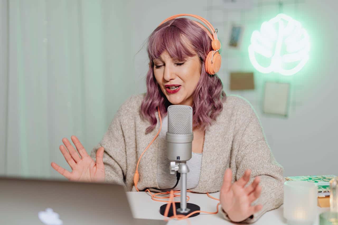 Woman talking on podcast microphone