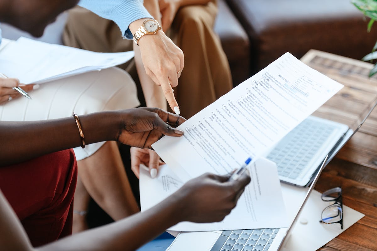 an agent reviewing real estate contracts with a client